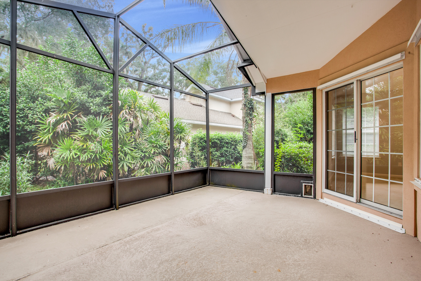 Empty Screened in Porch Attached to Modern House Outdoor No Furniture Home Netting